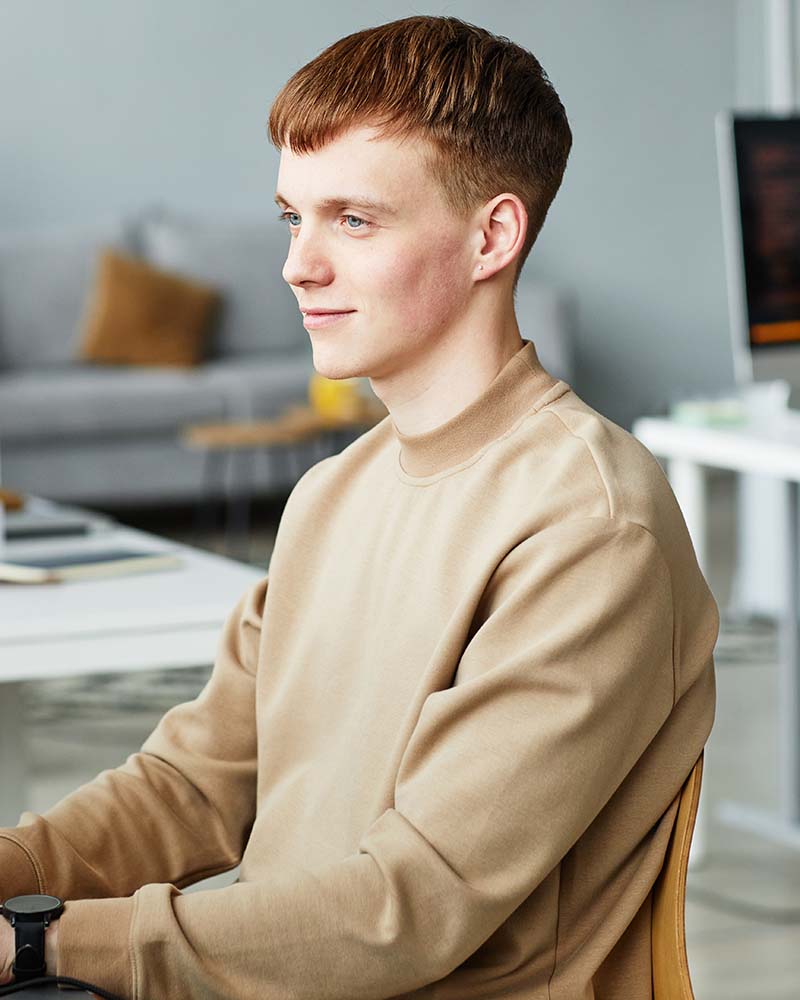 young man writing programming code on computer T4ZN6PC